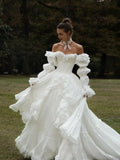Nuvara | Ariadna | Vestido de Novia Princesa con Volantes Mujer Manga Larga Hombros Descubiertos